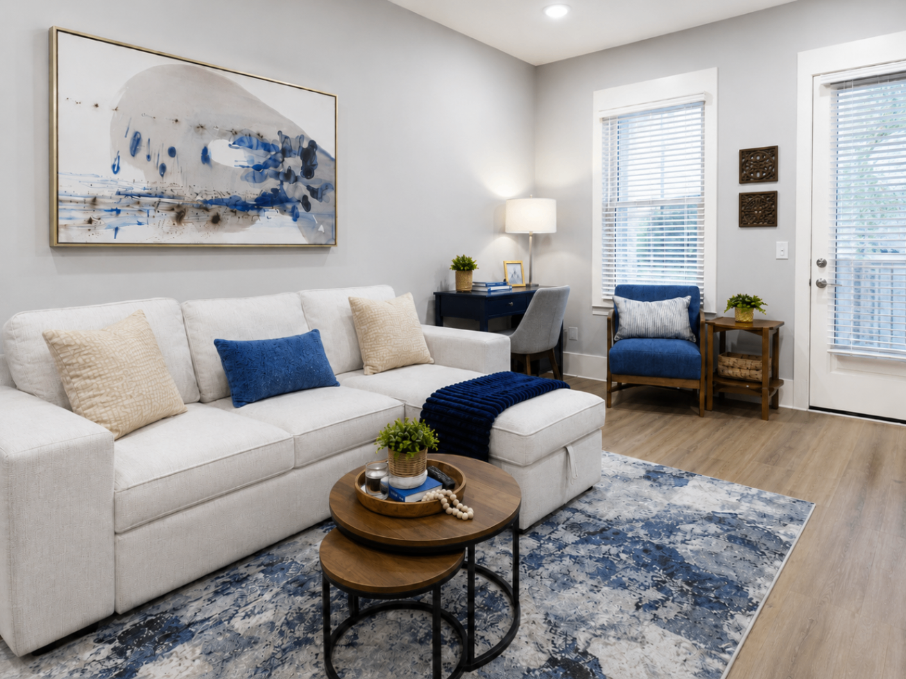 Modern living room with white sofa and navy accents